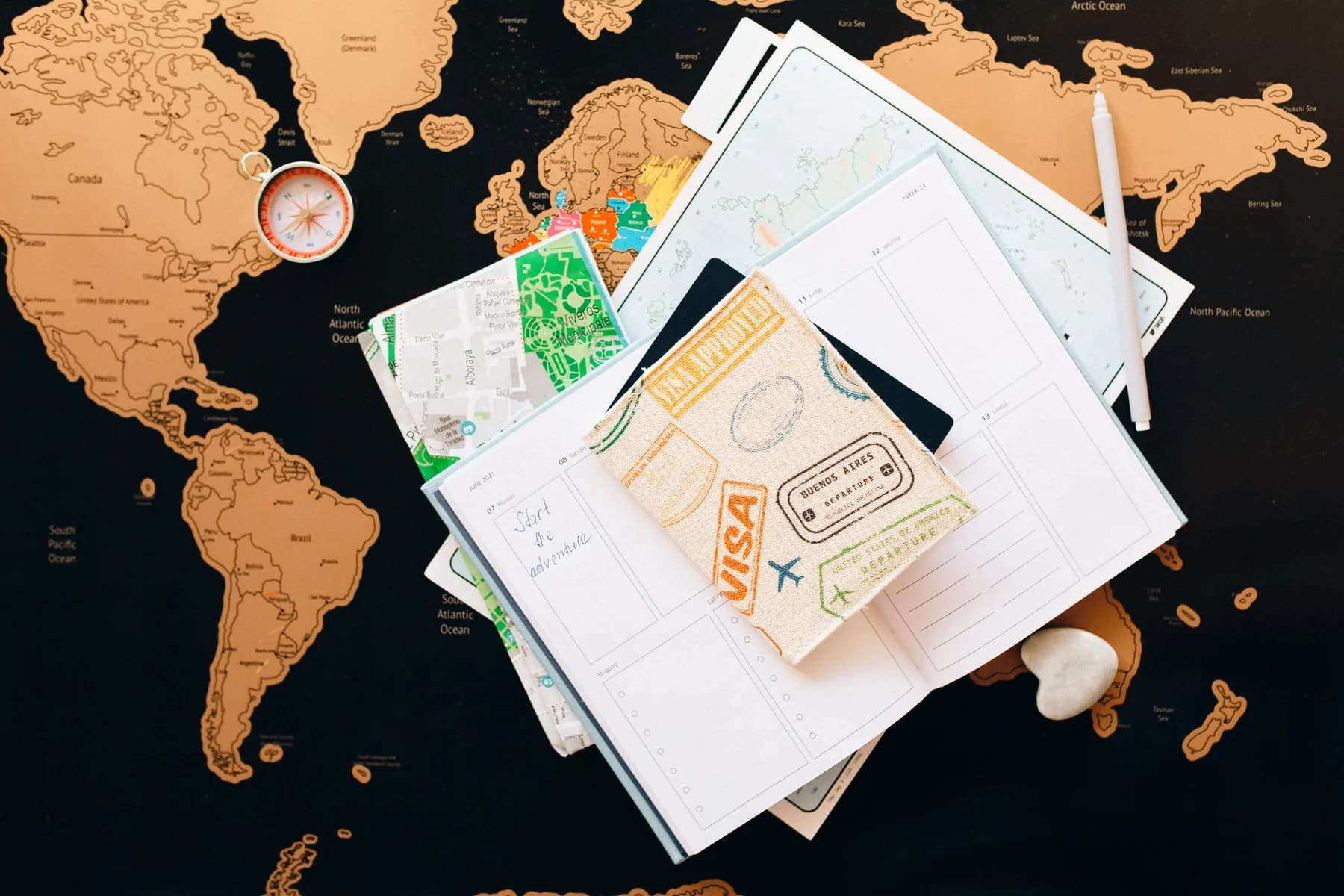 A passport and application planner arranged on a world map
